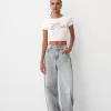 Camiseta espalda abierta con pedrería Cream