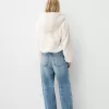 Chaqueta acolchada con capucha de pelo sintético Off white