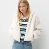 Chaqueta acolchada con capucha de pelo sintético Off white