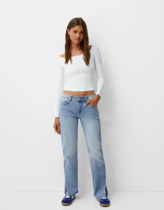 Jeans acampanados con dobladillo dividido Light blue