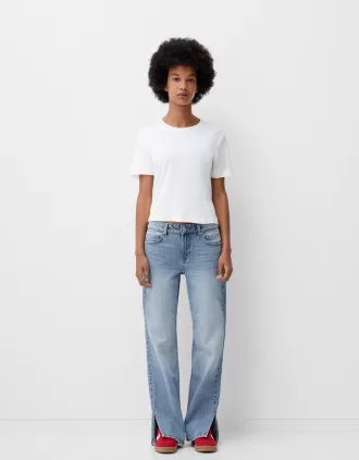 Jeans acampanados con dobladillo dividido Light blue