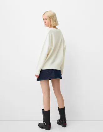 Jersey oversize con cuello de pico Cream