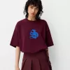 Minifalda con pliegues y detalle de lazo Maroon