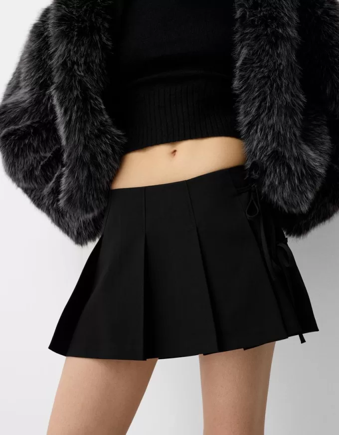 Minifalda con pliegues y detalle de lazo Black