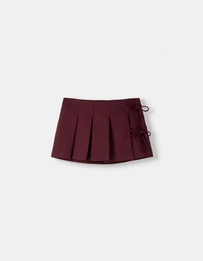 Minifalda con pliegues y detalle de lazo Maroon