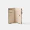 Monedero con estampado animal efecto charol grabado Cream