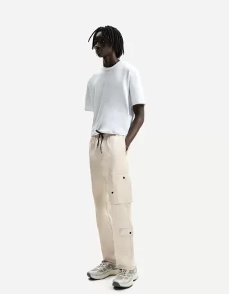 Pantalones multicargo anchos Sand