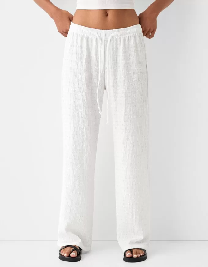 Pantalones rectos con punto waffle Off white