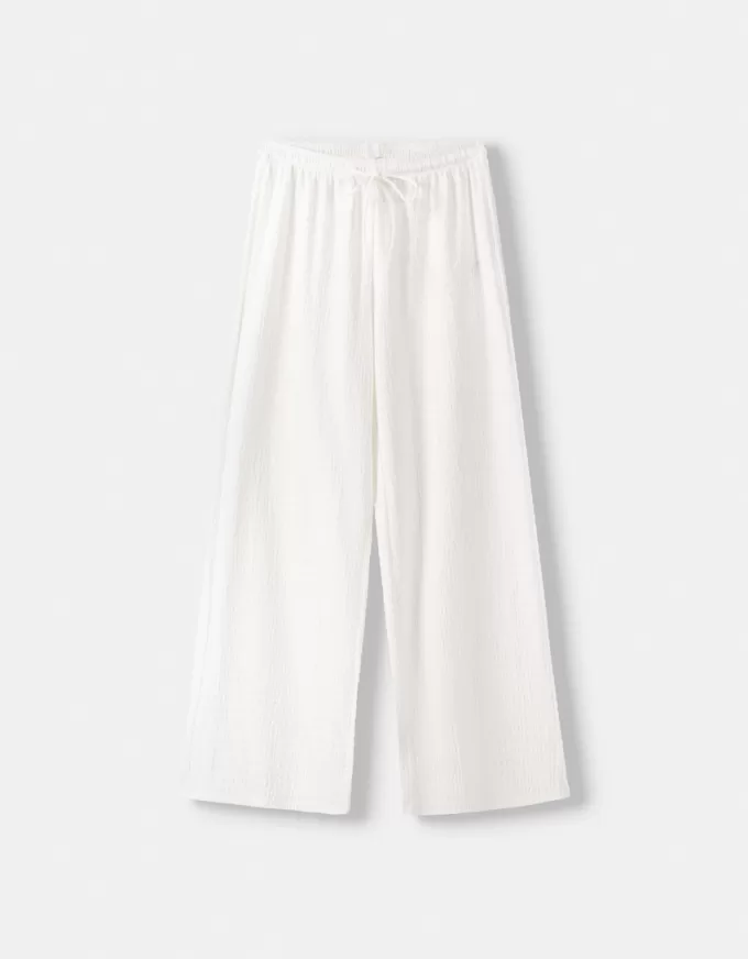 Pantalones rectos con punto waffle Off white
