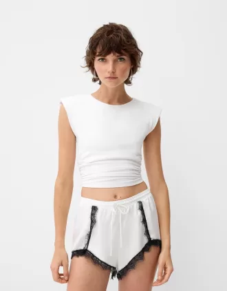 Shorts de encaje satinado Off white