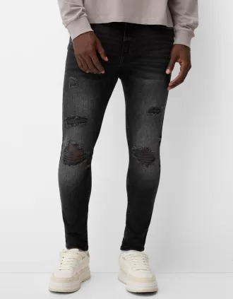 Vaqueros súper ajustados con rotos Black