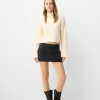 minifalda con tachuelas Black